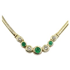 Bezel Set Diamond and Emerald Omega Necklace 14 Karat Yellow Gold