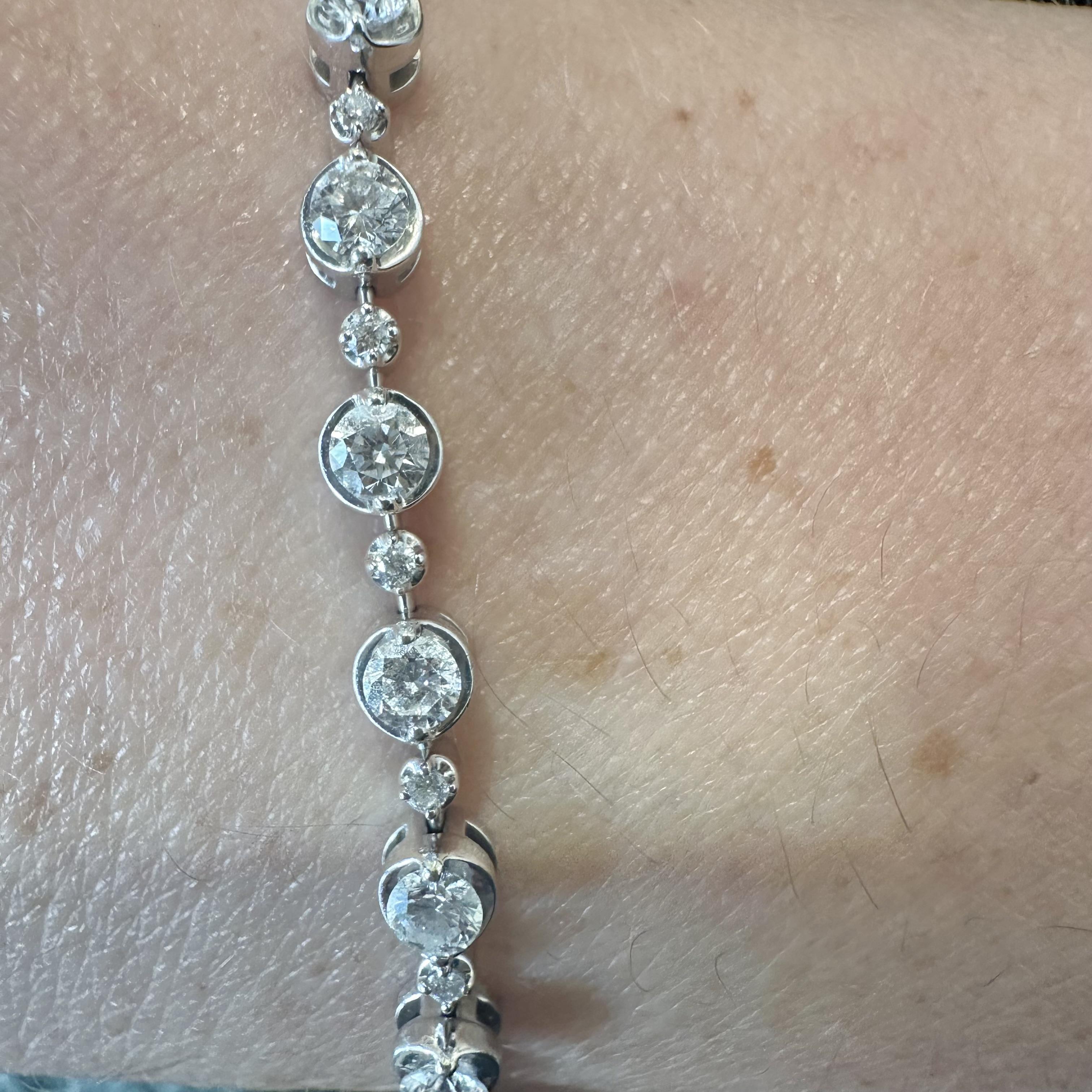 Style: Contemporary, single row linear alternating size pattern design bracelet
Material: White Gold
Metal Purity: 18k
Length: 7 inches
Stones: 47 Round Diamonds
Total Carat Weight: 2.23 
Diamond Color: G - H
Diamond Clarity: VS 2