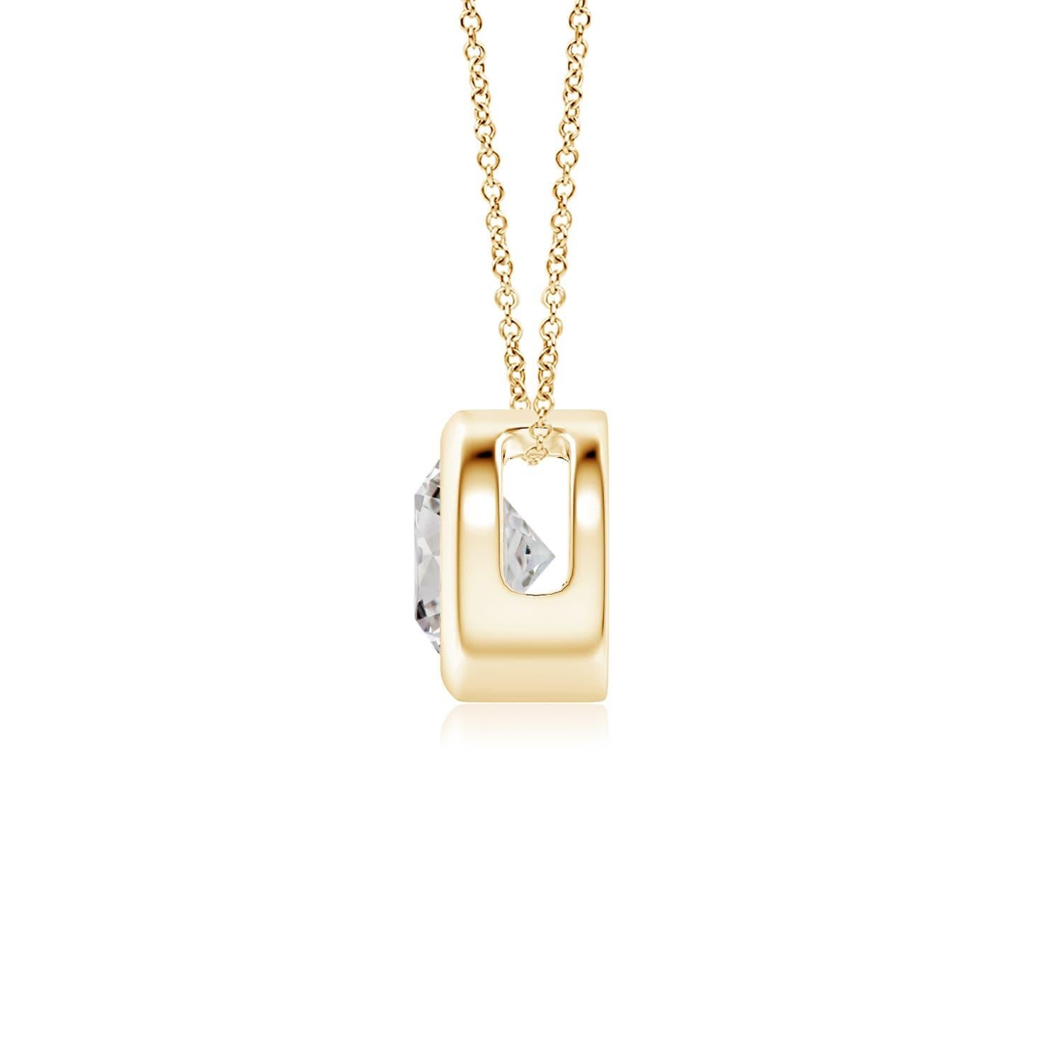 This classic solitaire diamond pendant's beautiful design makes the center stone appear like it's floating on the chain. The sparkling diamond is secured in a bezel setting. Crafted in 18k yellow gold, this round diamond pendant makes an elegant
