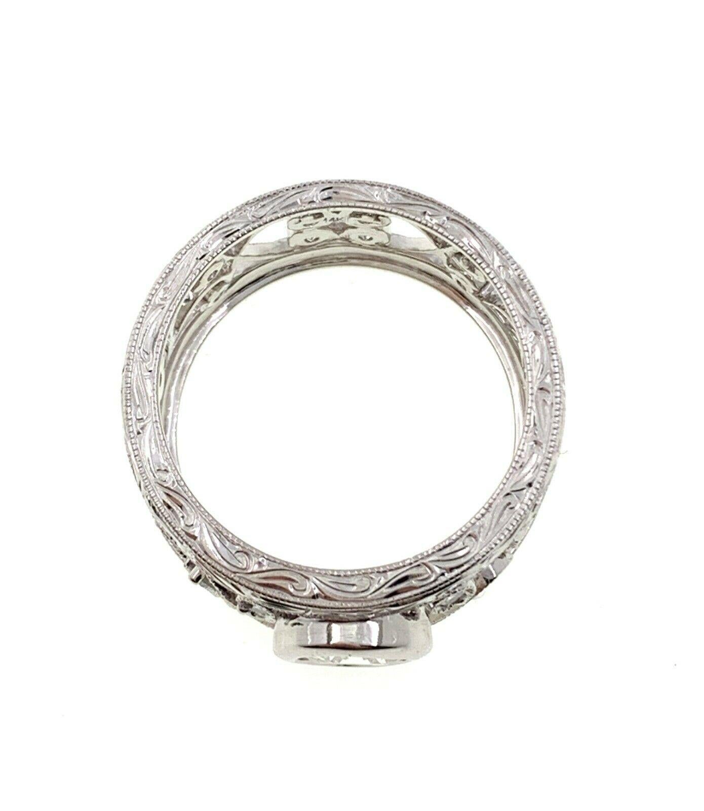 Bezel Set Floral Filigree Diamond Ring

Style:  Wide Filigree Ring with Hand Engraving Detail
Metal:  14K White Gold
Size / Measurements:  1/2'' wide ring, size 6.5 
TCW:  1.24 Carats Total
Main Diamond:  0.84 Round Brilliant Cut 
Color & Clarity: 