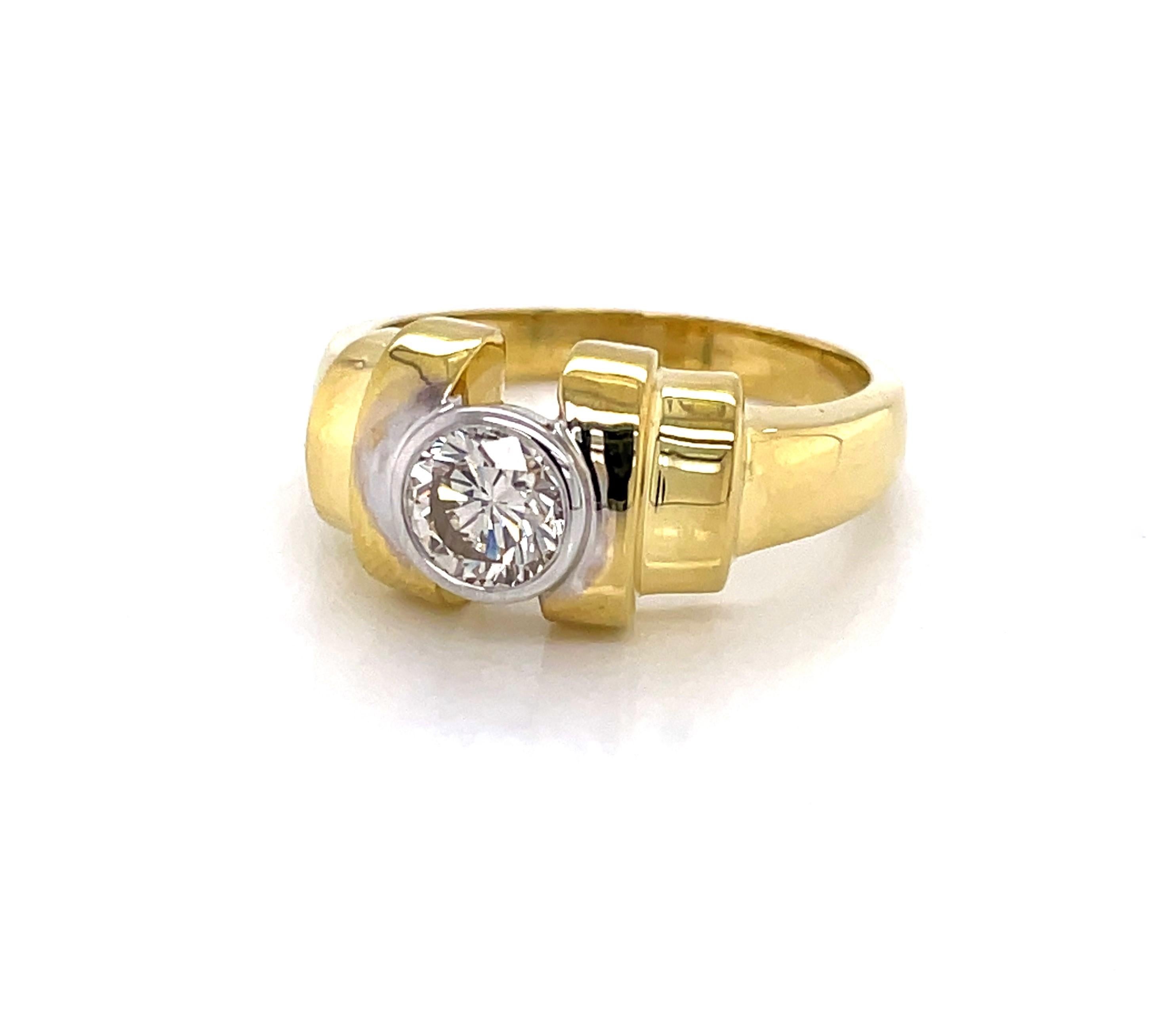 Custom made eighteen karat 18K yellow gold estate ring with attractive step style wide band leading to one full cut round faceted .94 carat H/VS diamond solitaire in a rhodium setting. Unisex, presently in ring size 9 and resizable. Excellent