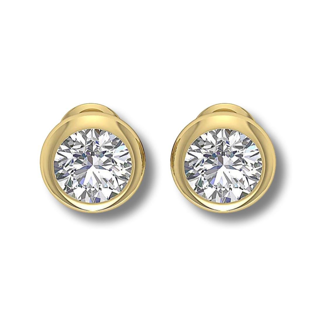 Style: Bezel-Set Solitaire Studs

Metal: Yellow Gold

Metal Purity: 18k

Stones: 2 Round Diamonds

Diamond Carat Weight: approx. 0.25 ct each (0.5ct total)

Diamond Clarity: VS1 - VS2

Diamond Color: G - H

Total Weight (grams): 1.0

Earring Back: