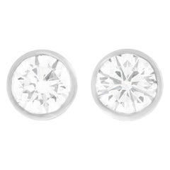 Bezel-Set Diamond Studs Platinum, circa 1990s, American