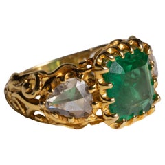 Anello con smeraldo e diamante incastonati in oro 22 carati
