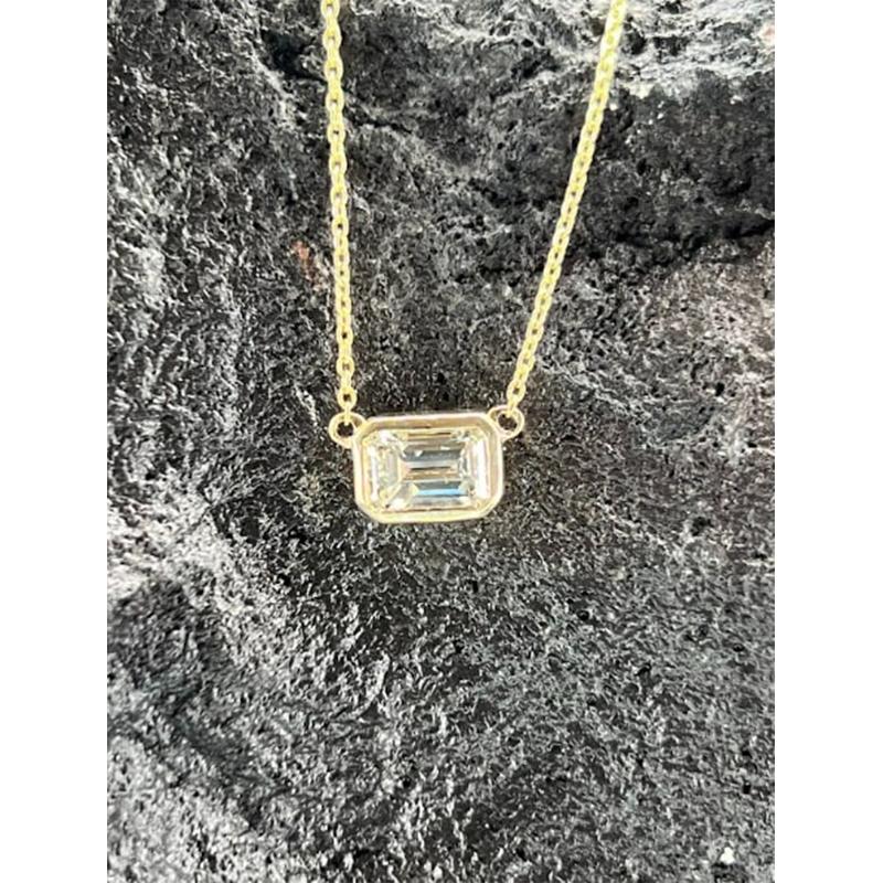 Modern Bezel Set Emerald Cut 18K Gold Diamond Necklace For Sale