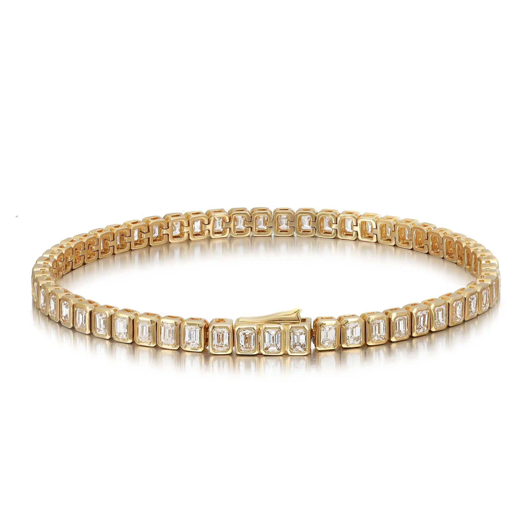 Classic yet elegant, this breathtaking diamond tennis bracelet is crafted in 18K yellow gold with 56 bezel set dazzling emerald cut diamonds. Total diamond weight: 4.84 carats. The bright white diamonds are G-H color and VS-SI clarity. Bracelet