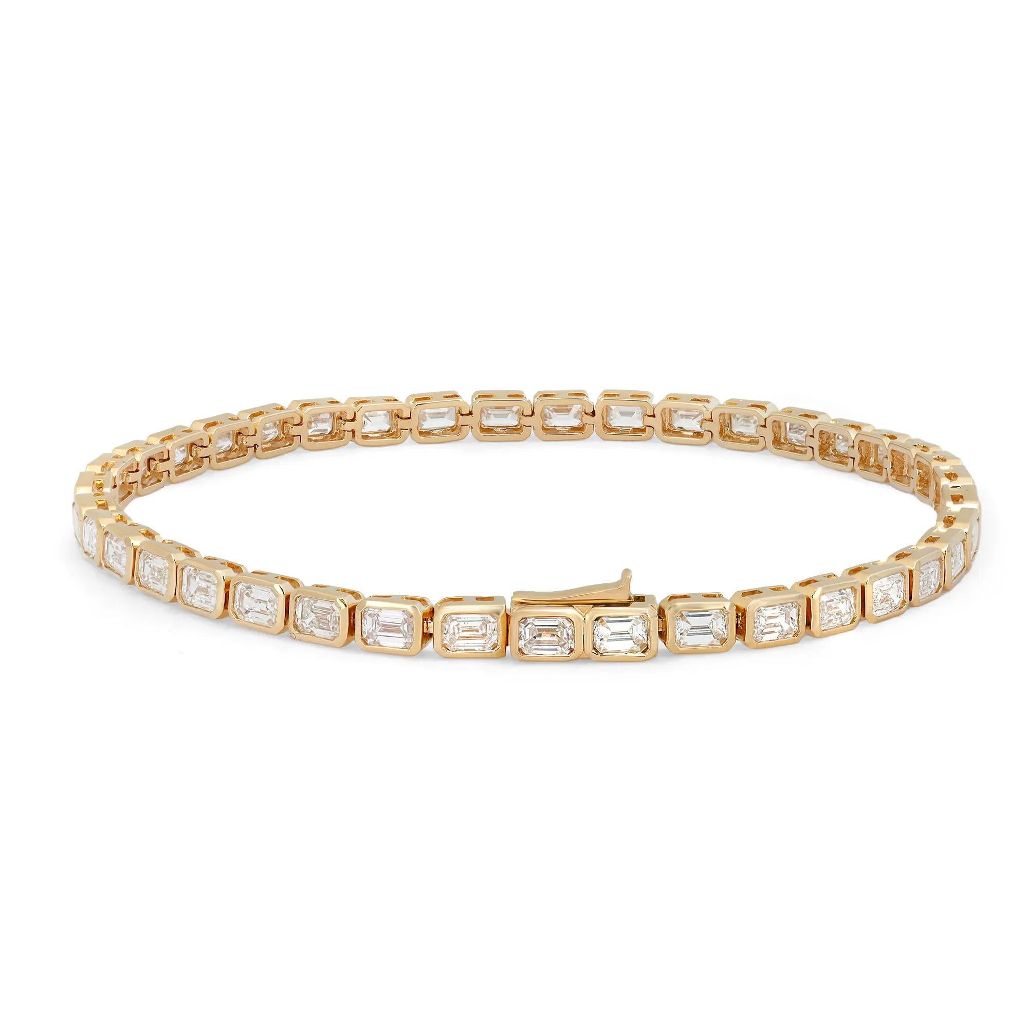 Classic yet elegant, this breathtaking tennis bracelet is crafted in 18K yellow gold with 39 bezel set dazzling emerald cut diamonds. Total diamond weight: 7.00 carats. The bright white diamonds are G-H color and VS-SI clarity. Bracelet length: 7