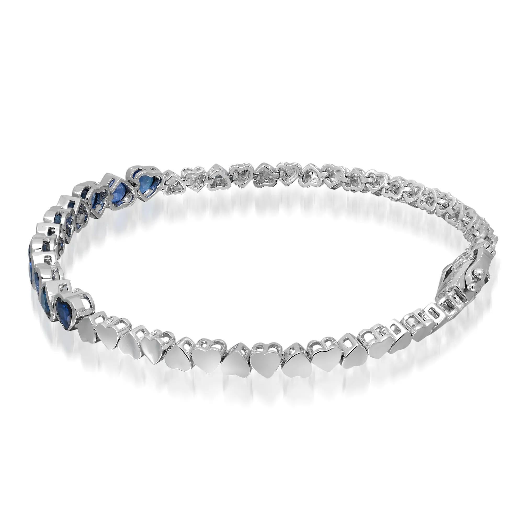 This beautiful blue sapphire bracelet exudes sophistication. Crafted in lustrous 14K white gold, it features 11 heart shape blue sapphires studded in bezel setting. Total blue sapphire weight: 10.61 carats. Bracelet length: 7 inches. Width: 5mm.