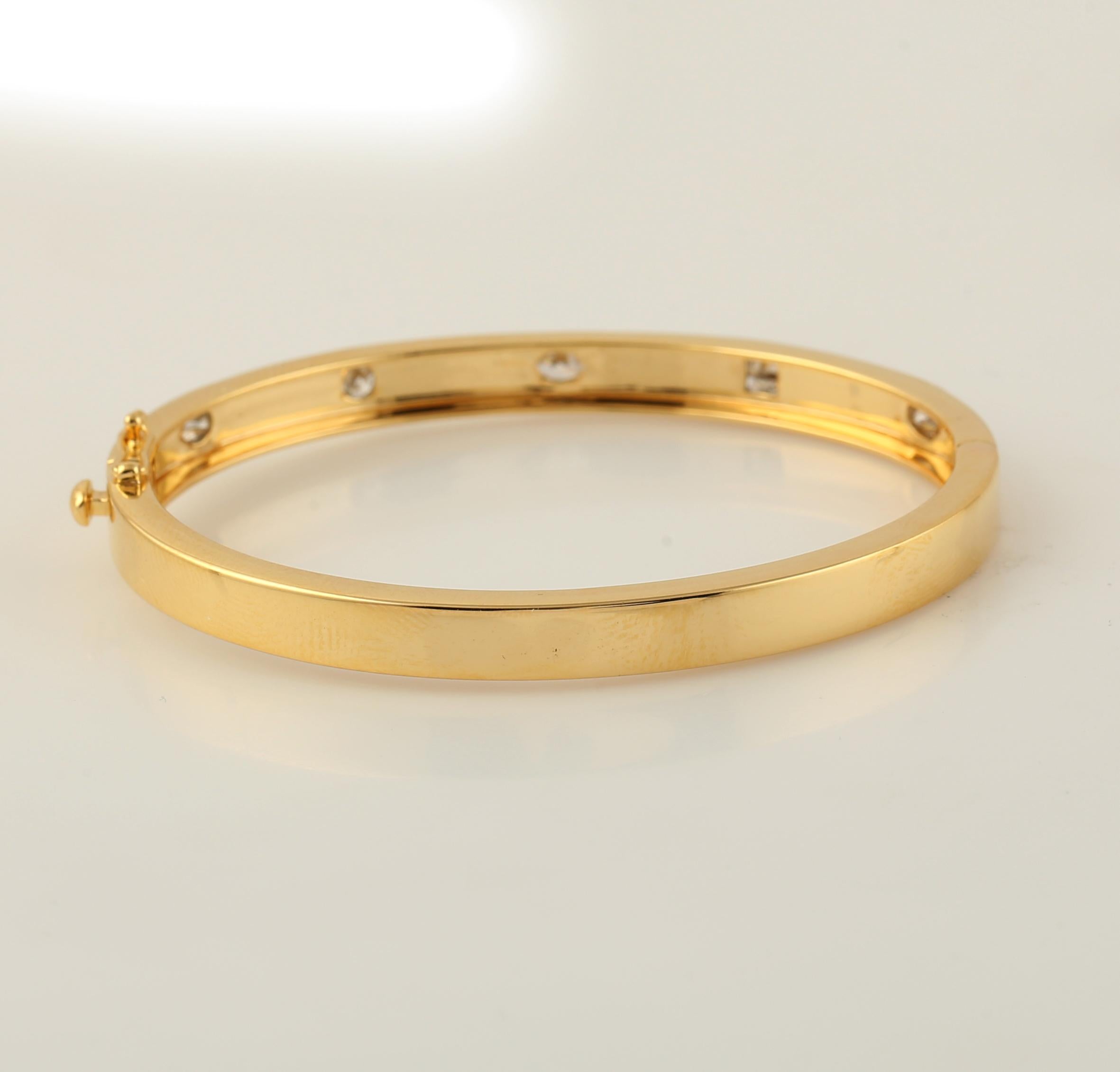 Contemporary Bezel Set Multi Shape Diamonds Bangle Made In 18K Yellow Gold For Sale