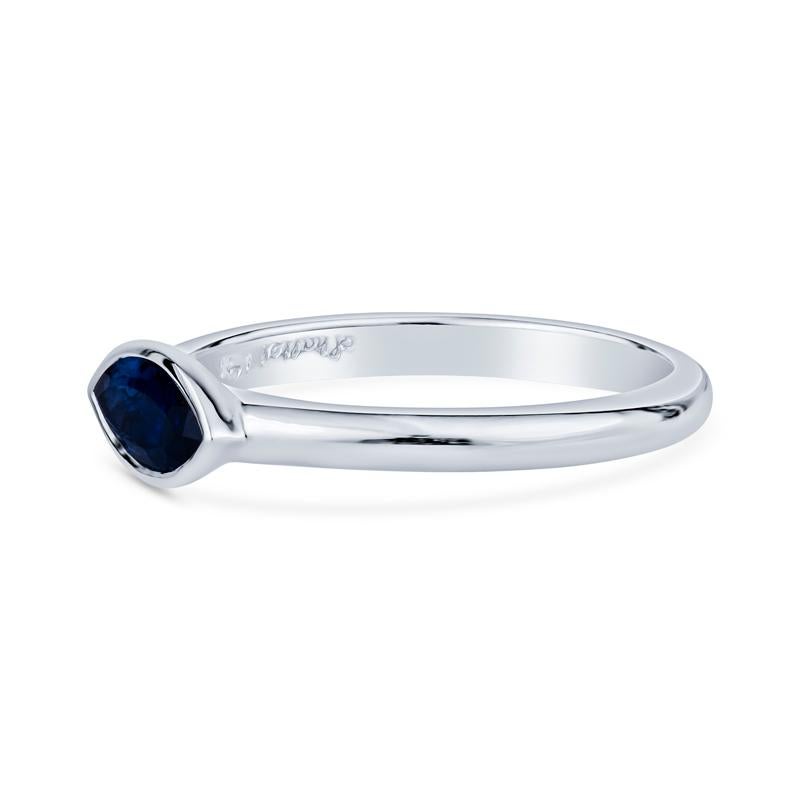 Adorn your finger with this exquisite marquise-shaped blue sapphire ring, featuring a brilliant bezel set 0.63-carat natural stone set in luxurious 14 karat white gold. Designed for women who appreciate elegance, this ring effortlessly blends