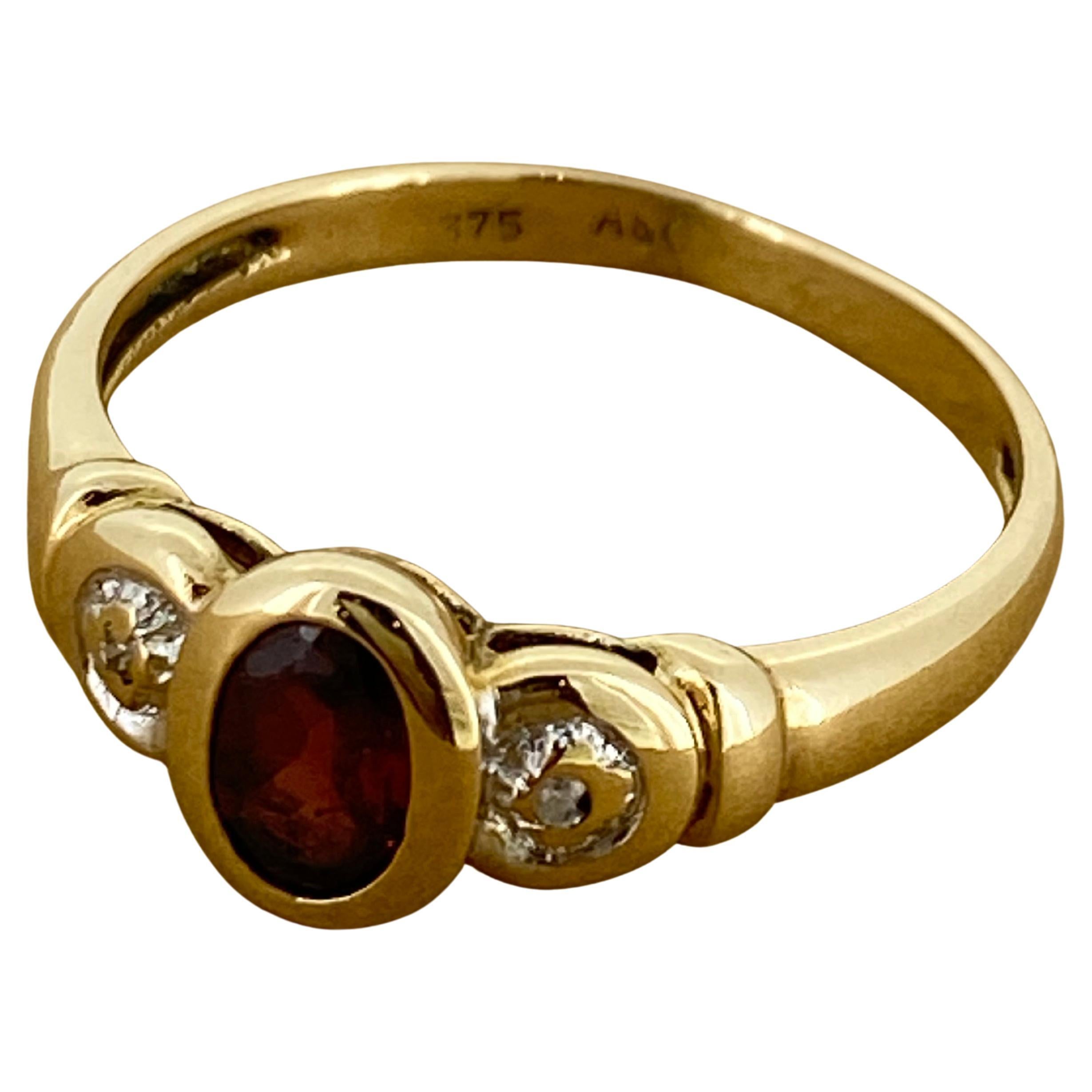 Of an exquisite timeless design, this vintage dress ring 
is set with an oval Natural Garnet 
of stunning deep red colour, 
of oval shape, bezel set
Shoulders are decorated with small sparkles 

Crafted in 9K Yellow Gold
rounded shank measure 2.5 –