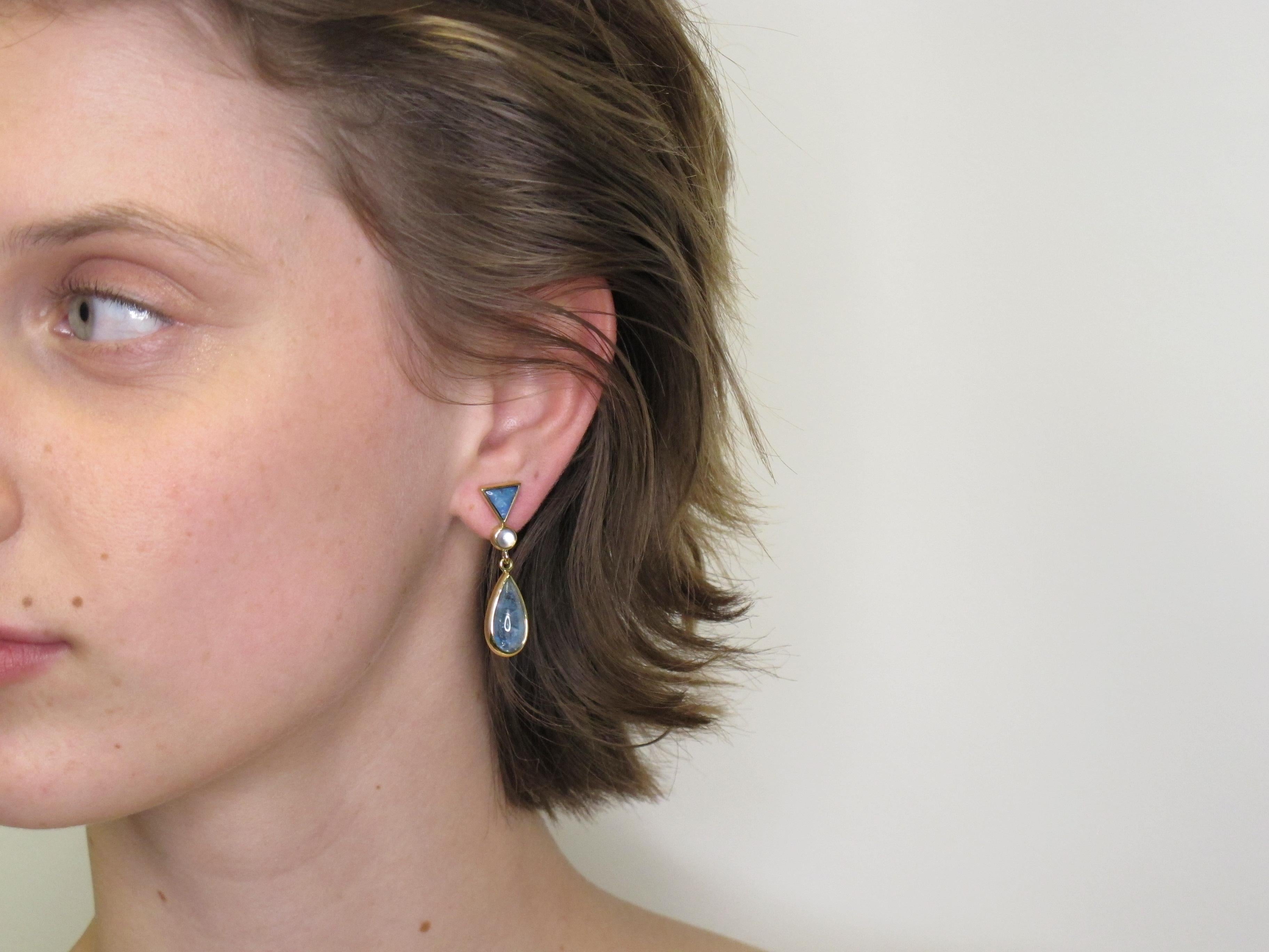 This is such a pretty pair of earrings! They are custom and one-of-a kind; we made them in our workshop, here in Los Angeles.  Cabochon cut opals (6.5x6.5mm /2.02 carats total),  round moonstones (4.00mm/.60 carats total) and pear shaped aquamarines