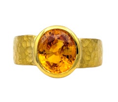 Bezel Set Oval Cut Citrine Solitaire Ring in Hammered 22 Karat Yellow Gold