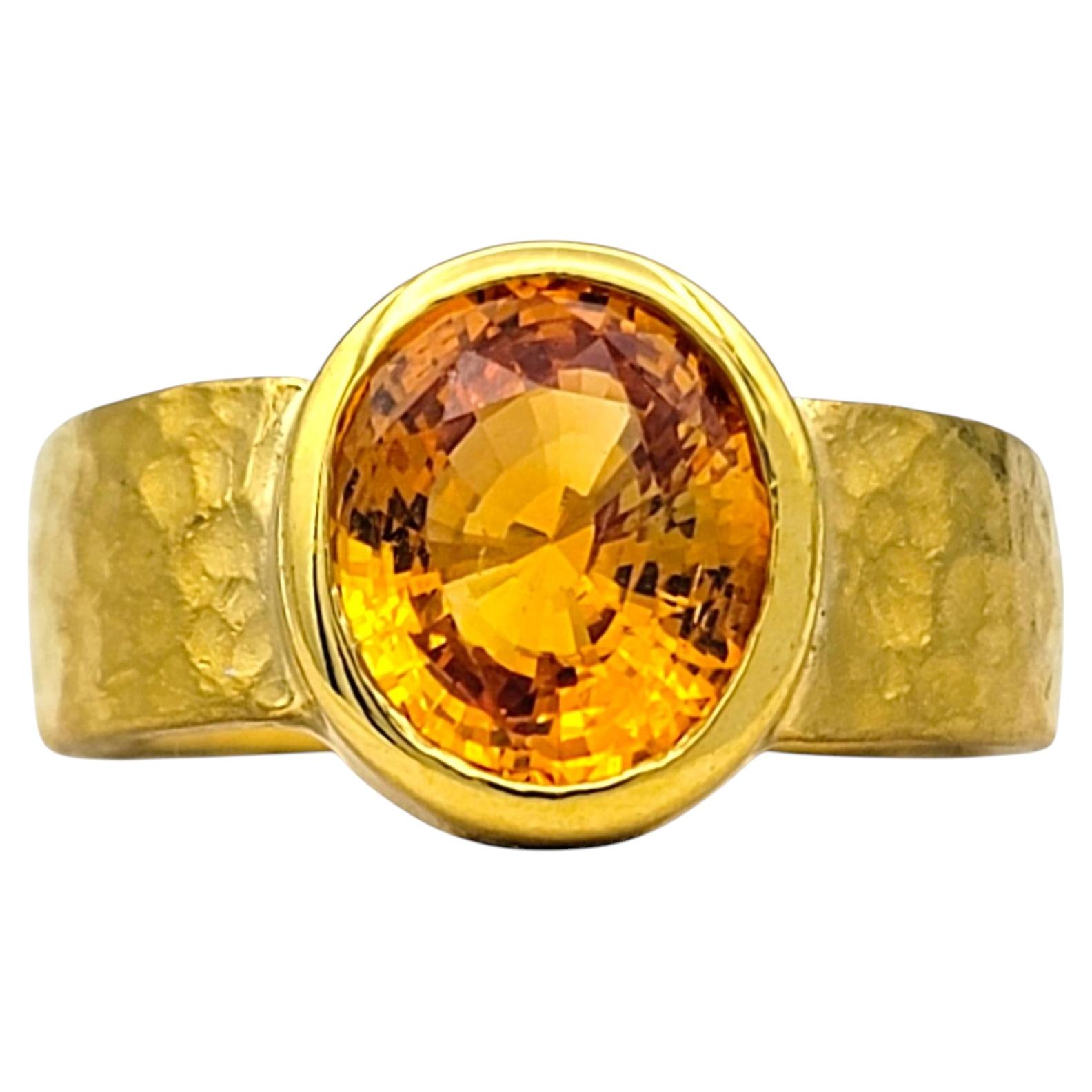 Bezel Set Oval Cut Citrine Solitaire Ring in Hammered 22 Karat Yellow Gold