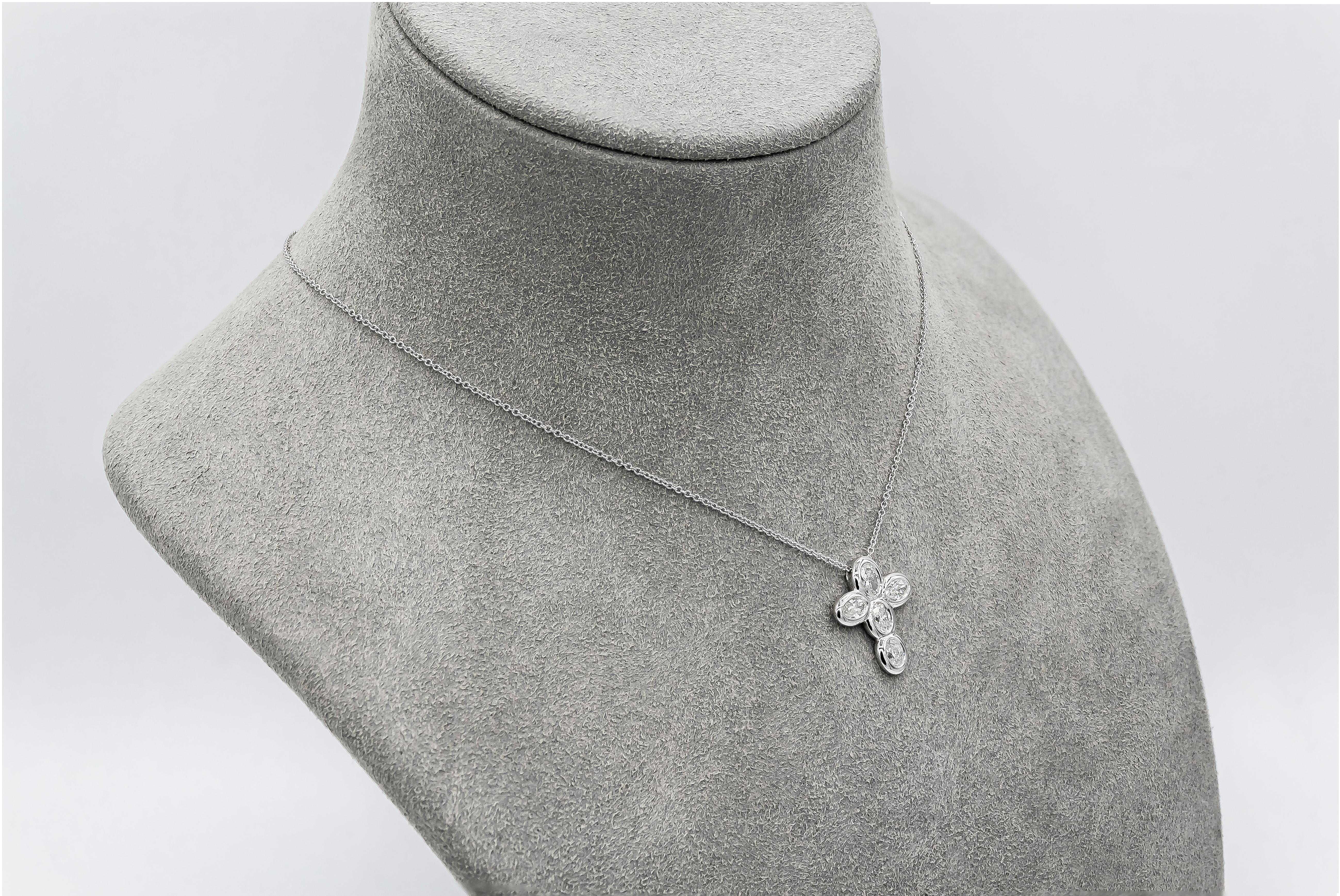 A unique pendant necklace showcasing five oval cut diamonds weighing 0.90 carats total, H color and VS in clarity, bezel set in a cross design. Attached to an 16 inch white gold chain, adjustable upon request.
Length of pendant = 0.72 inches
Width