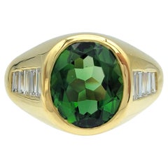 Bezel Set Oval Cut Green Tourmaline and Baguette Diamond Ring in 18 Karat Gold