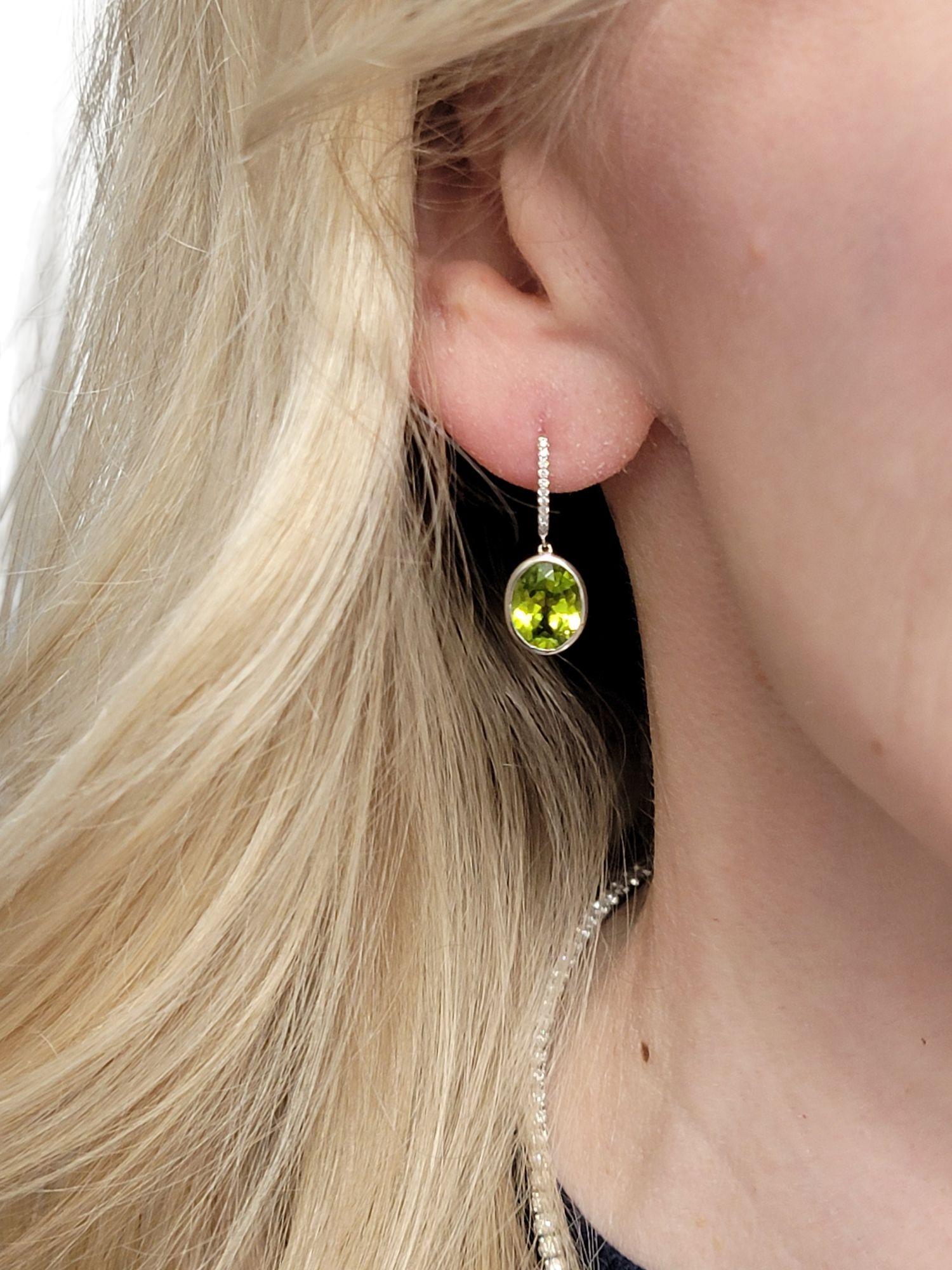 Bezel Set Oval Cut Peridot Dangle Earrings with Diamonds in 14 Karat White Gold For Sale 5