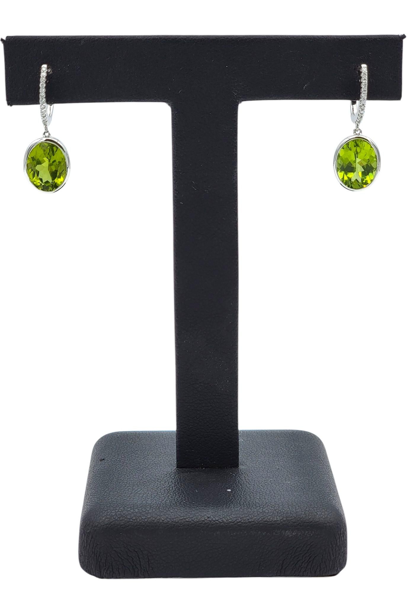 Bezel Set Oval Cut Peridot Dangle Earrings with Diamonds in 14 Karat White Gold For Sale 6