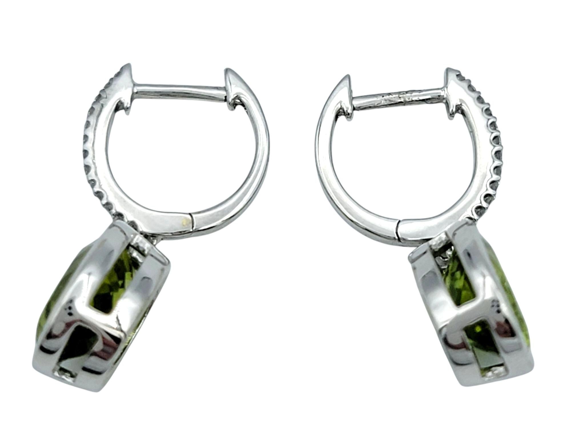 Bezel Set Oval Cut Peridot Dangle Earrings with Diamonds in 14 Karat White Gold For Sale 2