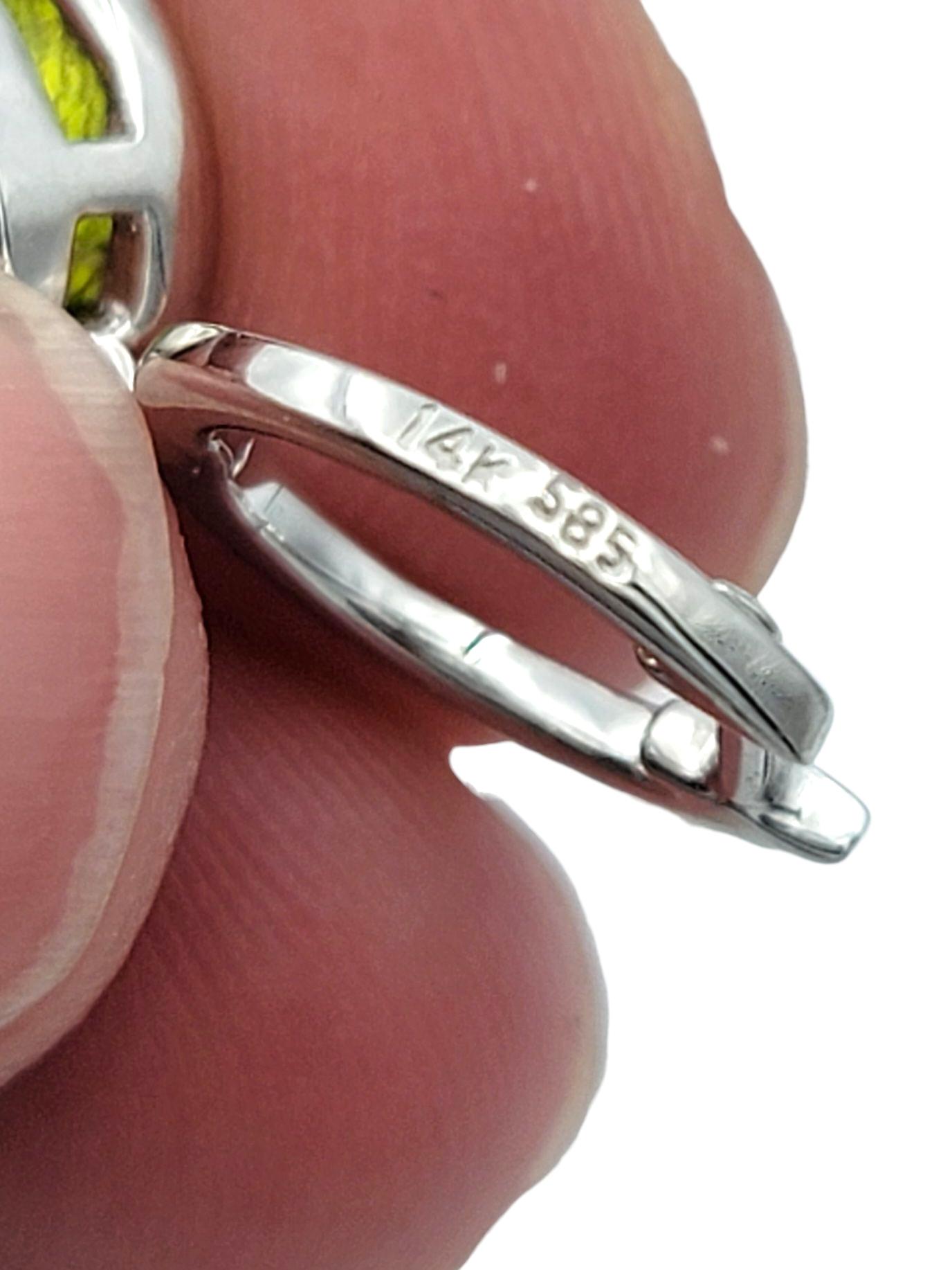 Bezel Set Oval Cut Peridot Dangle Earrings with Diamonds in 14 Karat White Gold For Sale 3