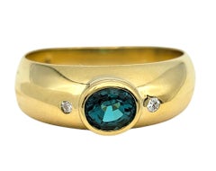Bezel Set Oval Paraiba Tourmaline and Diamond Band Ring in 18 Karat Yellow Gold