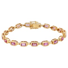 Bracelet tennis en or jaune 14 carats serti d'un saphir rose de 5,28 ct. pt. 7 pouces