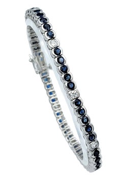 Bezel Set Round Blue Sapphire & Diamond Tennis Bracelet in 14 Karat White Gold