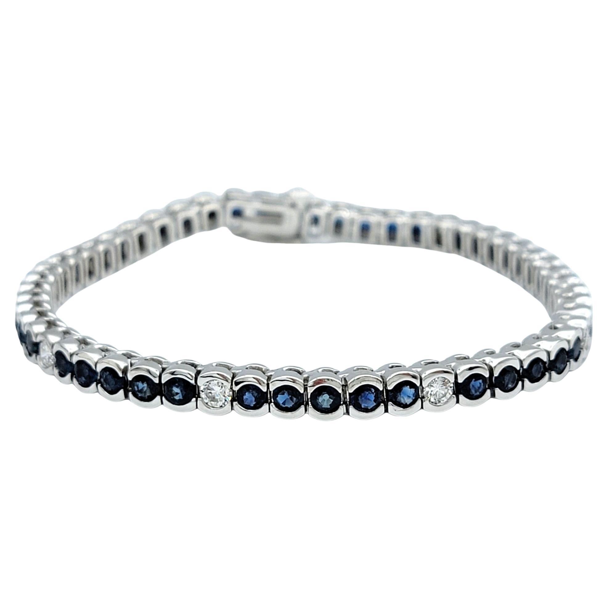 Bezel Set Round Blue Sapphire & Diamond Tennis Bracelet in 14 Karat White Gold