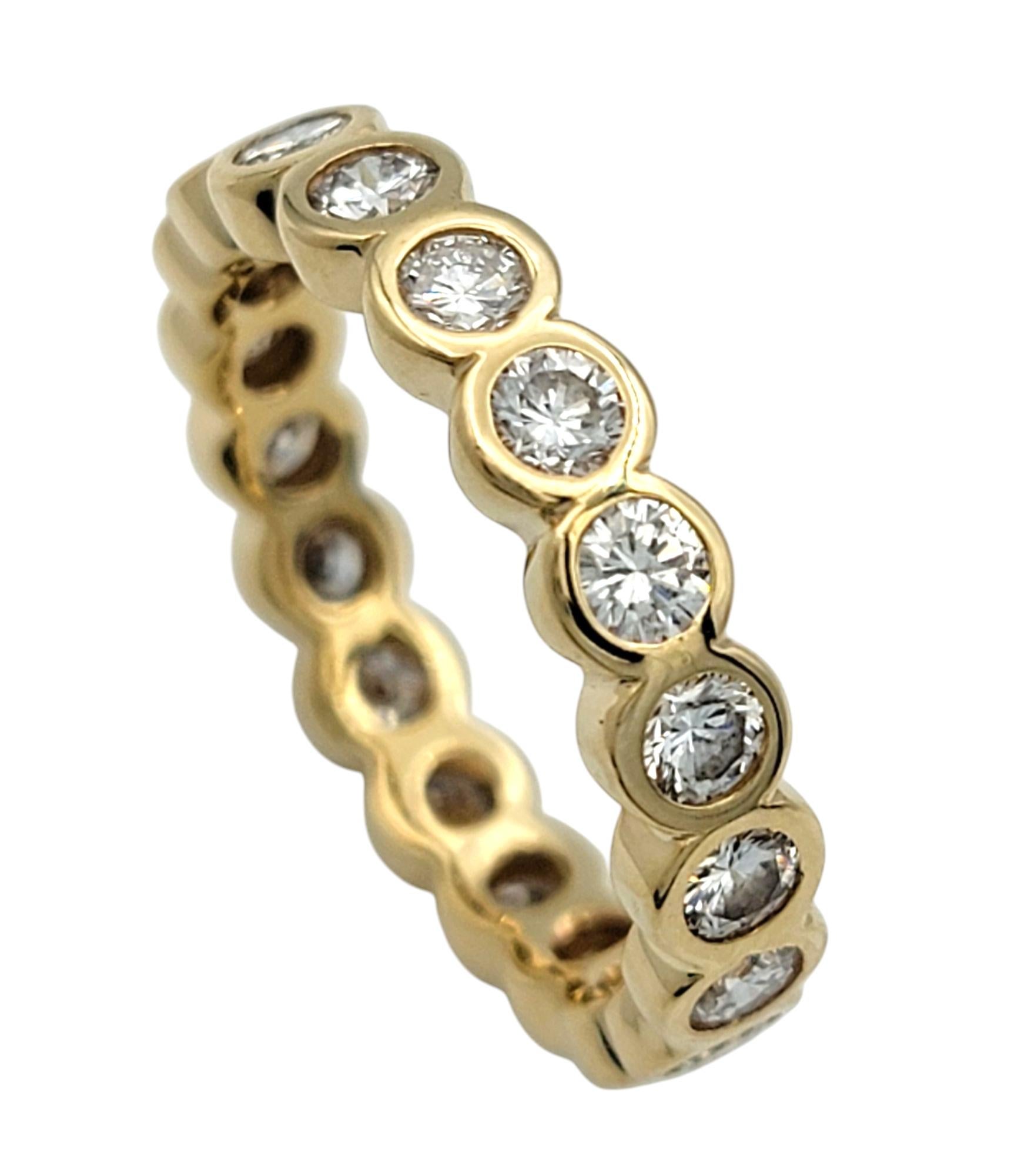 Ring Size: 6

Crafted in luminous 14 karat yellow gold, this modern diamond eternity band is a timeless expression of elegance and sophistication. A full circle of round brilliant-cut diamonds encircles the band, creating a continuous display of