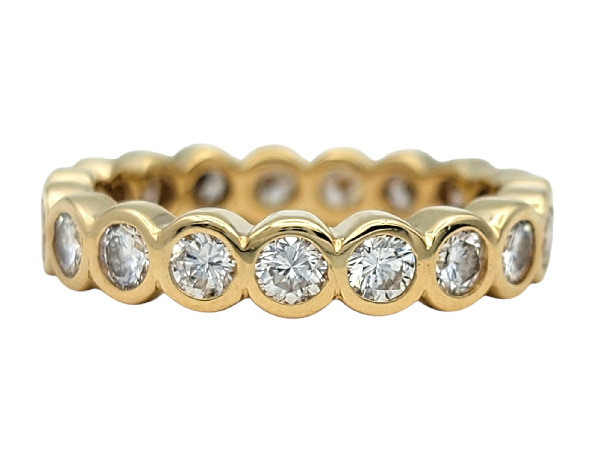 Contemporary Bezel Set Round Brilliant Cut Diamond Eternity Band in 14 Karat Yellow Gold For Sale