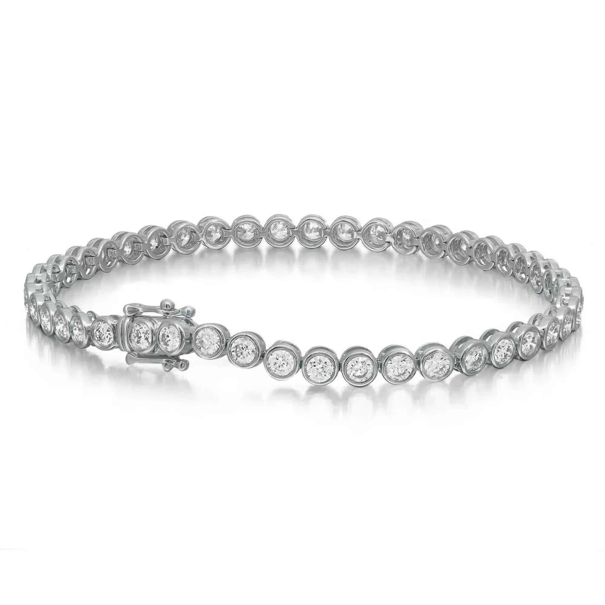 This exquisite Rachael Koen tennis bracelet features round brilliant cut diamonds in bezel setting style crafted in 18k white gold. Lightweight and super stackable, this handmade modern creation is a great addition to your jewelry collection. This