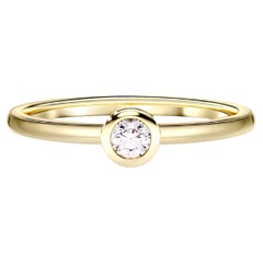 Bezel Set Round-Cut Moissanite Engagement Ring in 14k Gold.