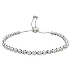Bracciale Bolo regolabile con diamanti rotondi incastonati in oro bianco 14 carati