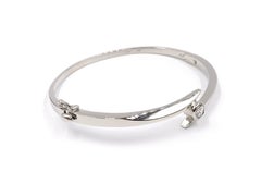 Bezel Set Round Diamond Bypass Platinum Bangle