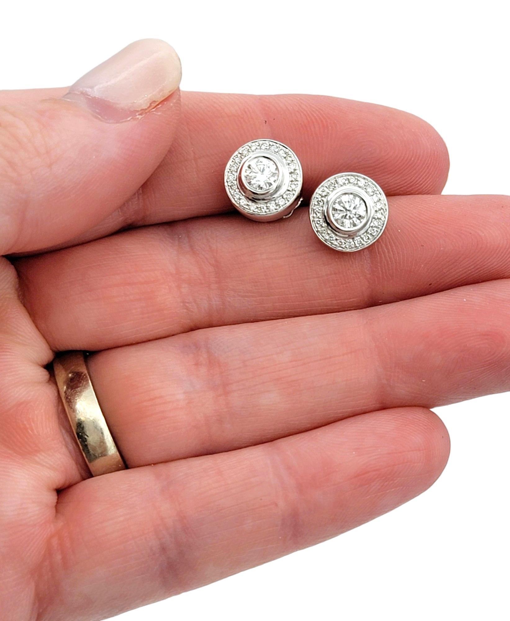 Women's Bezel Set Round Diamond Halo Design Stud Earrings in 14 Karat White Gold For Sale