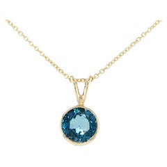 Bezel-set round London blue topaz pendant
