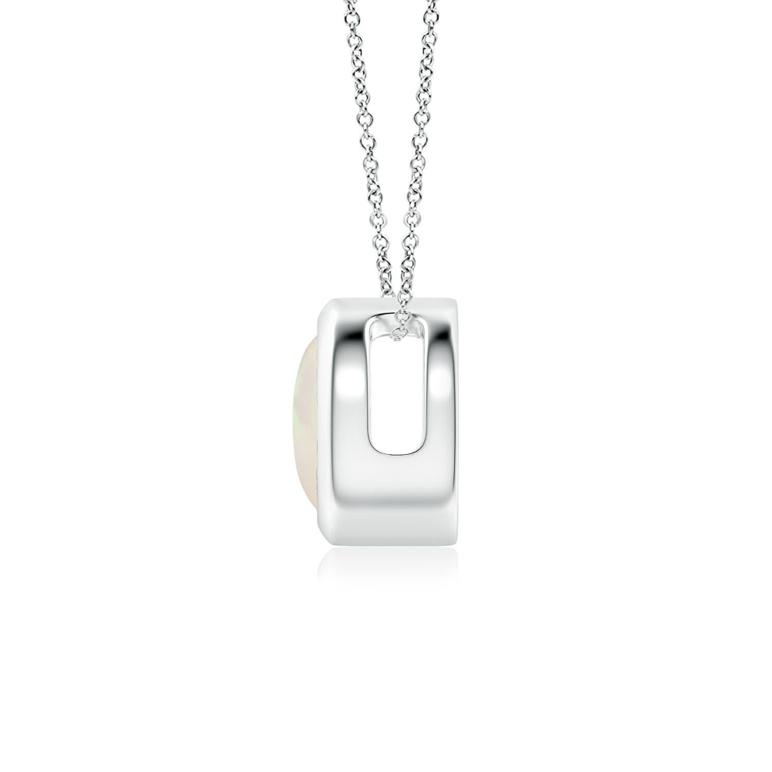 The mesmerizing round opal appears to be floating on the chain. It is secured in a 14k white gold bezel setting. This simple yet alluring opal pendant is designed to make an elegant style statement with its stunning play of colors. Available in