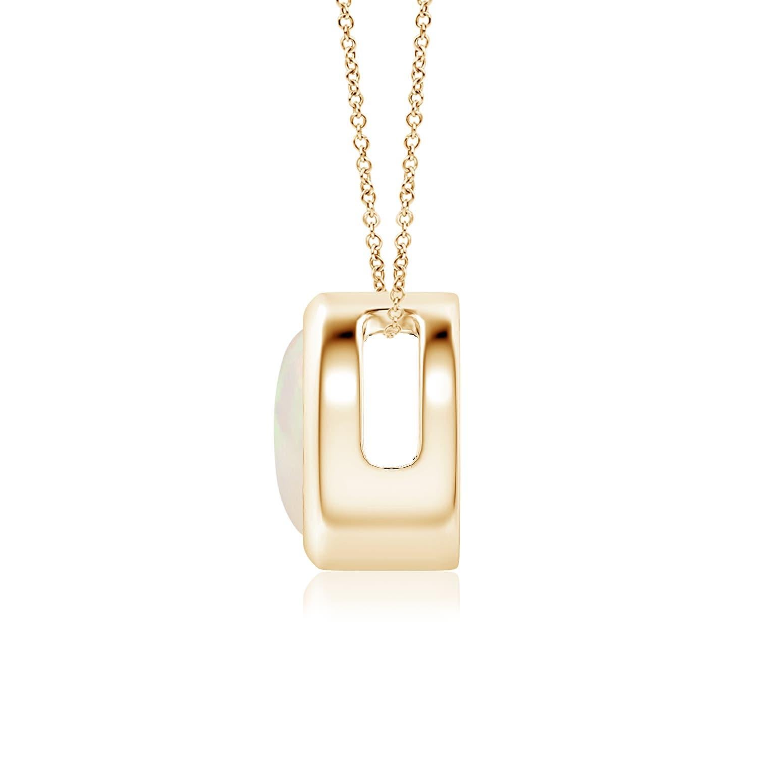 The mesmerizing round opal appears to be floating on the chain. It is secured in a 14k yellow gold bezel setting. This simple yet alluring opal pendant is designed to make an elegant style statement with its stunning play of colors. Available in