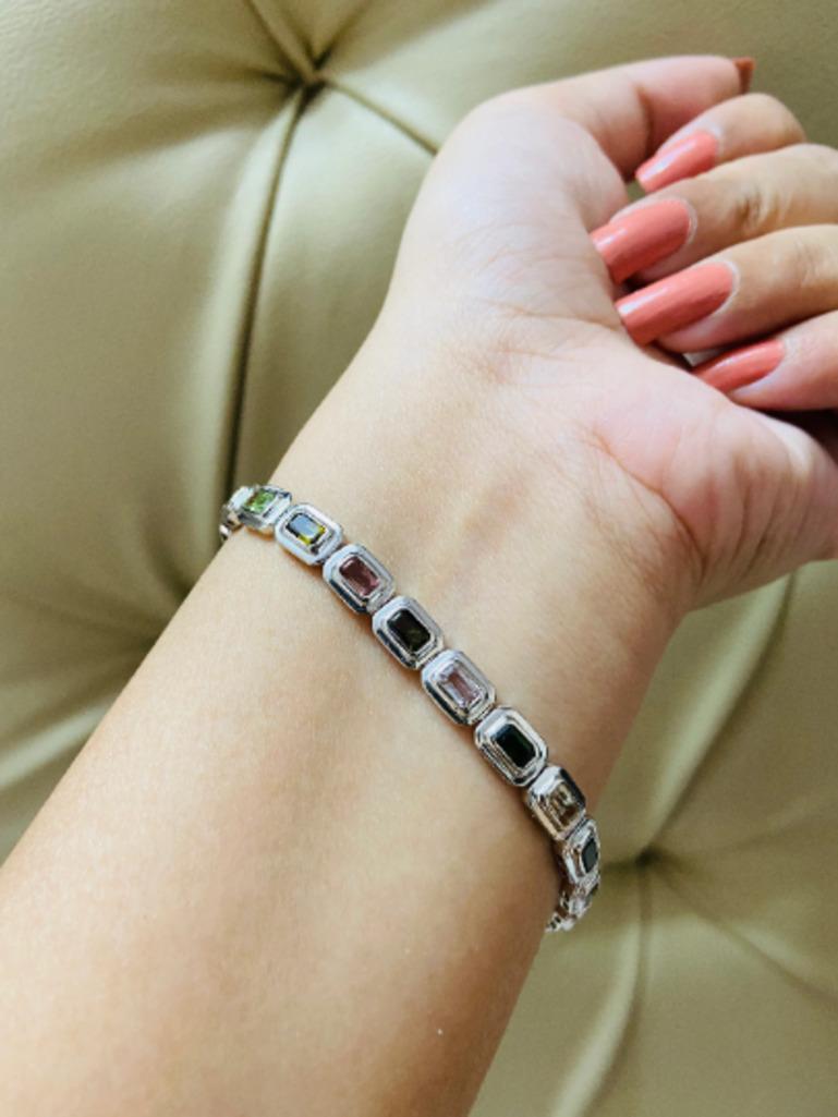Beautifully handcrafted silver Bezel Set Tourmaline Tennis Bracelet, designed with love, including handpicked luxury gemstones for each designer piece. Grab the spotlight with this exquisitely crafted piece. Inlaid with natural multi tourmaline