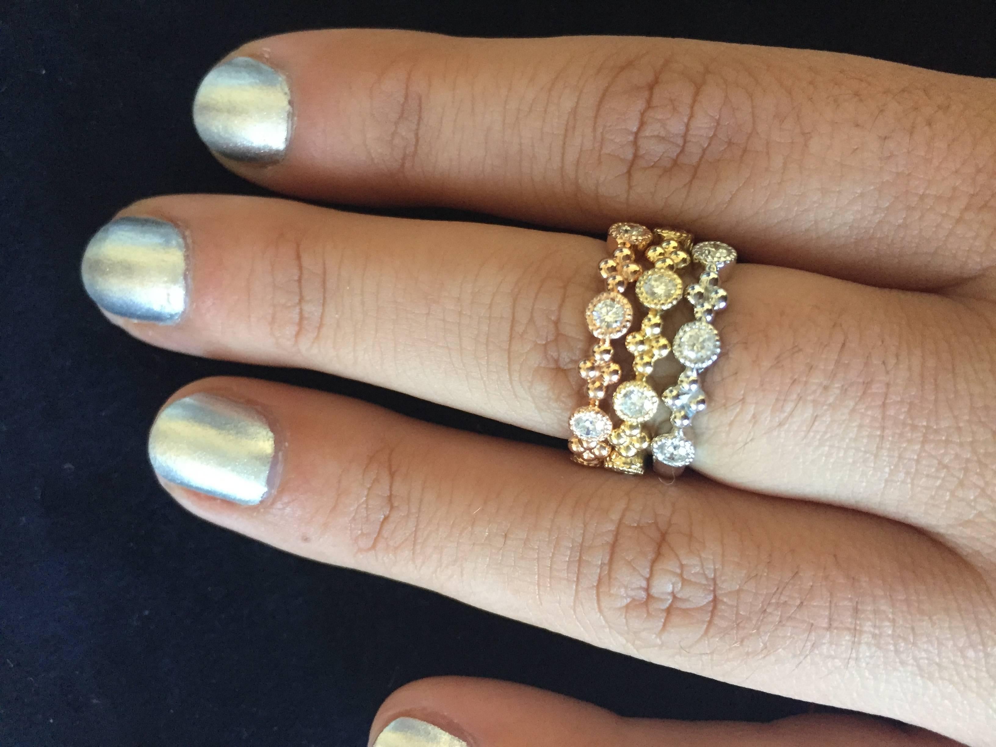 These fashion stackable rings are set in a bezel. The rings are 3/4 of the way eternity making it easy to size. These bands are elegant, but also trendy at the same time. The color is H and the clarity is SI2. These bands can be sold individually as