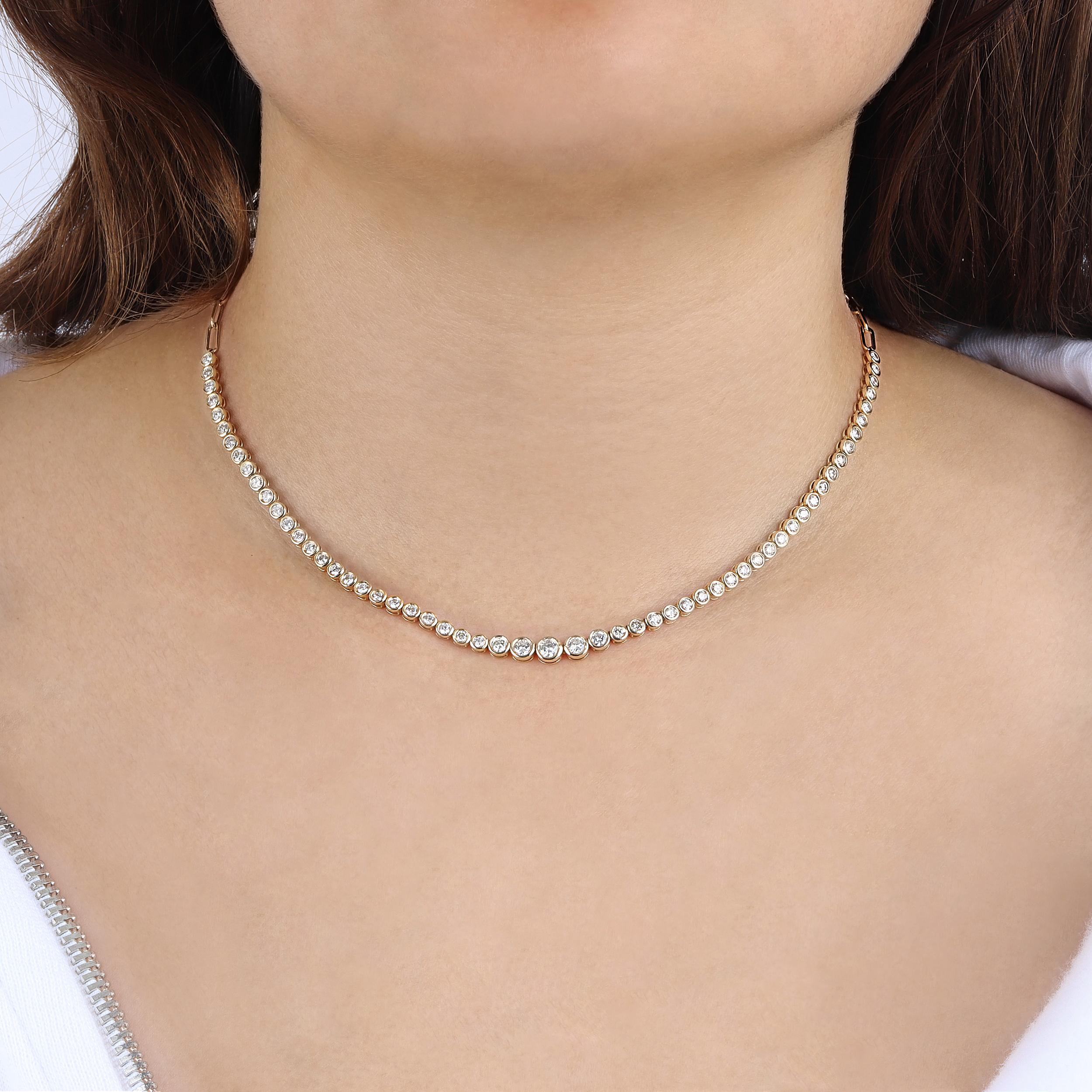 This stunning Bezel Tennis Necklace, featuring a chic paper clip design. Crafted from luxurious 14k yellow gold and adorned with natural diamonds, this piece combines classic beauty with modern style.

Necklace Information
Diamond Type : Natural