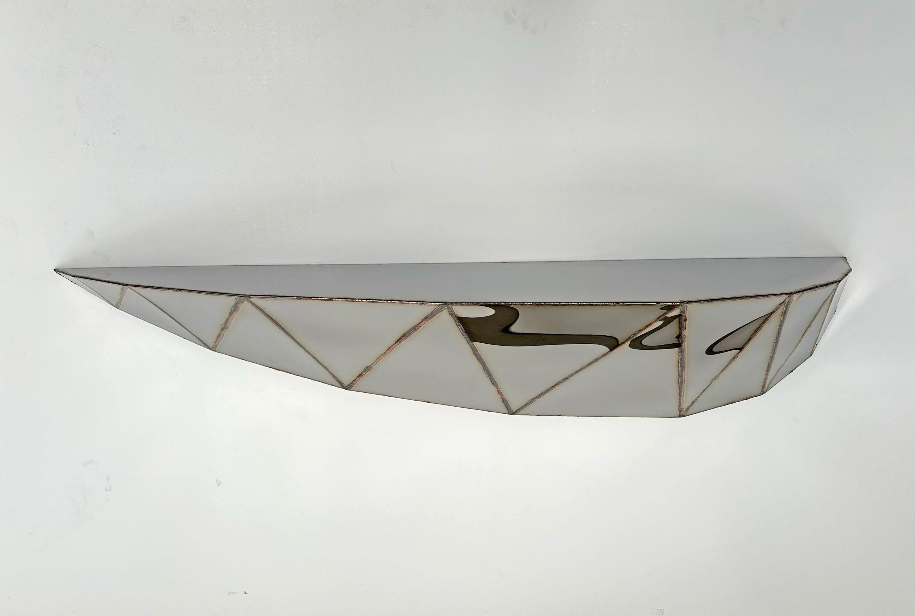 Bezier Shelf in Welded Mirror-Polished Stainless Steel by Julian Mayor
Limited Edition of 8 + 4AP.
Dimensions: D 30 x W 141 x H 31 cm. 
Materials: Mirror-polished stainless steel.

Julian Mayor is a British artist and designer renowned for his
