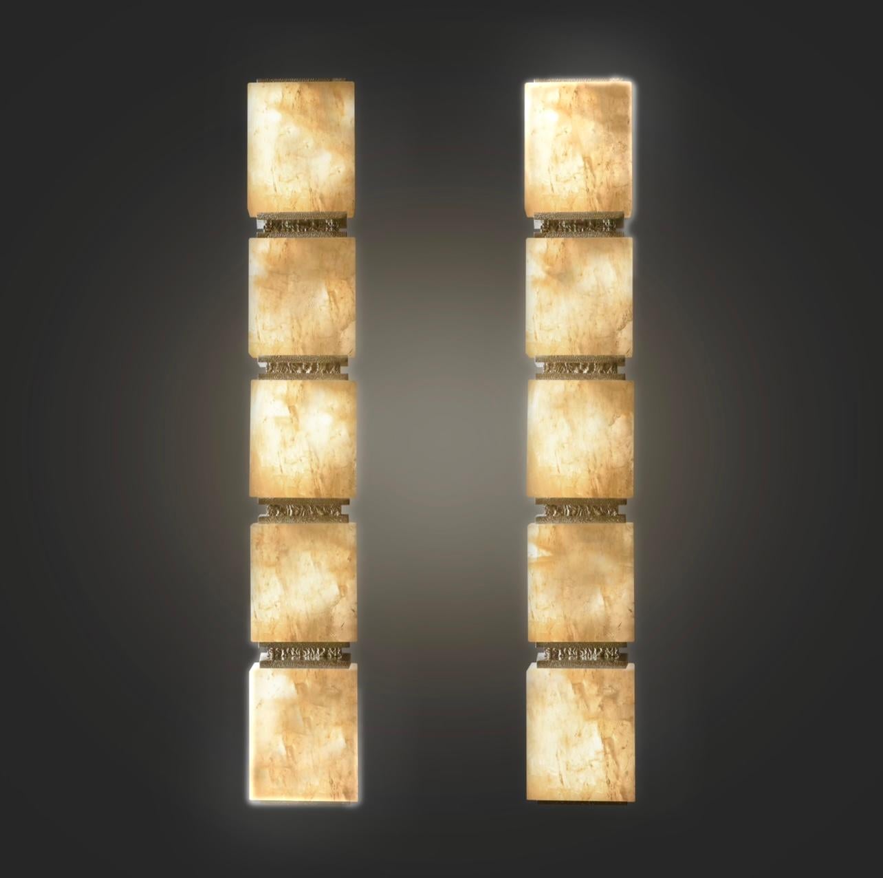 Blocks From Rock Crystal sconces with hammered polished nickel frame.
Created by Phoenix 
 e12 sockets installed for each sconce .400w total 

Custom Metal finish and size upon request.