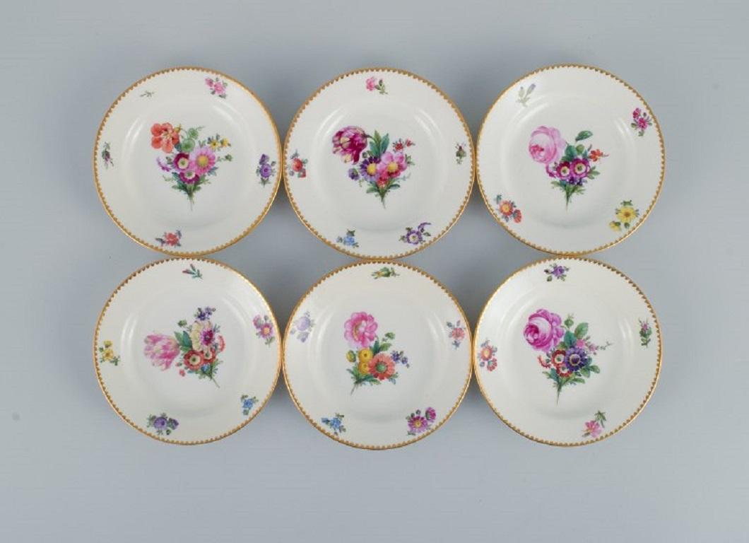 B&G, Bing & Grondahl Saxon flower.
Six cake plates decorated with flowers and gold trim.
circa 1920s.
In perfect condition.
Marked.
First factory quality.
Dimensions: D 14.0 x H 2.5 cm.