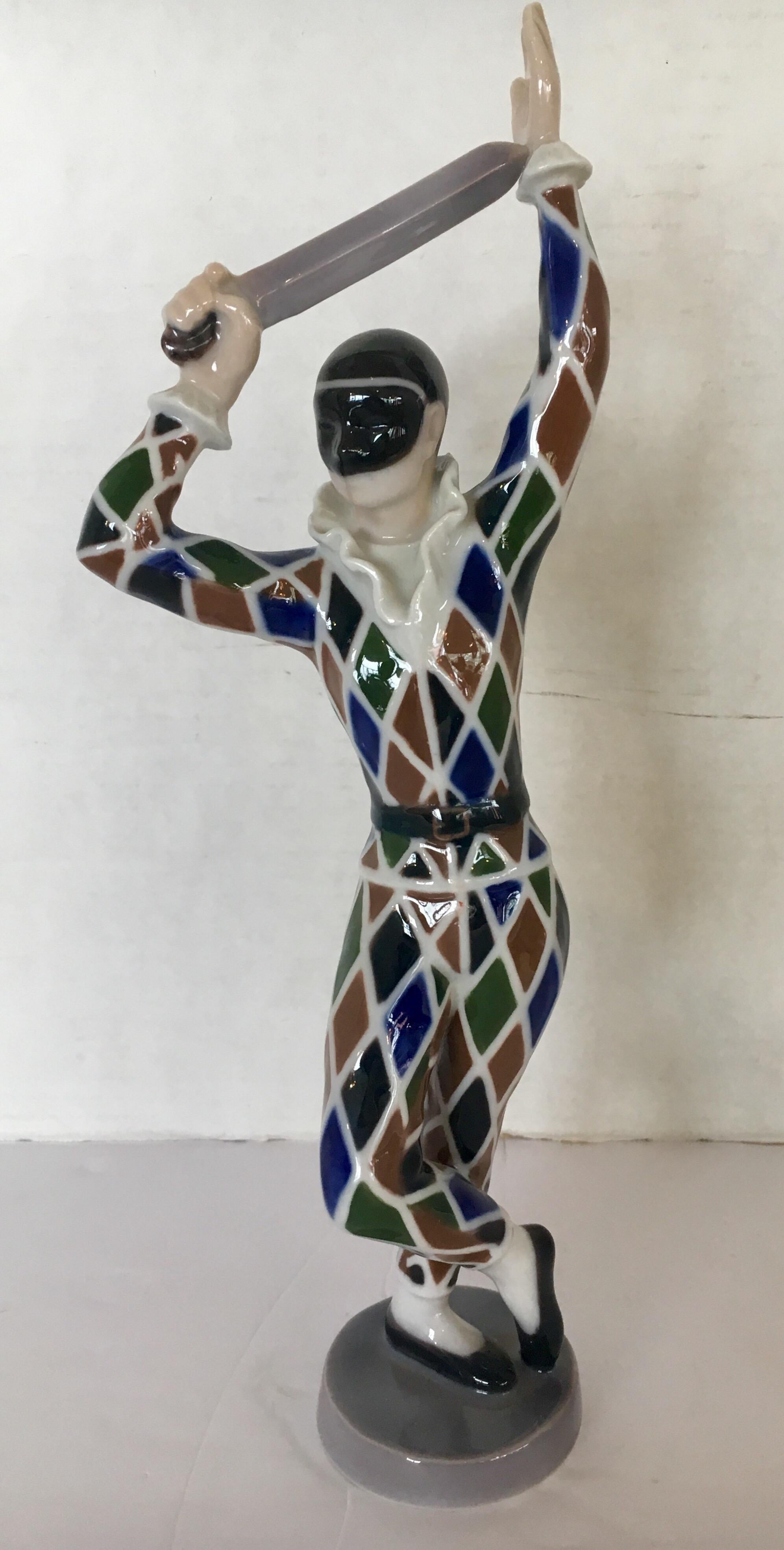 Signed B&G Copenhagen Harlequin series figurine. Mint condition, hallmarked with 2354 DR and all B&G hallmarks. Vivid colors of brown, green, blue, black, white and a silver sword.