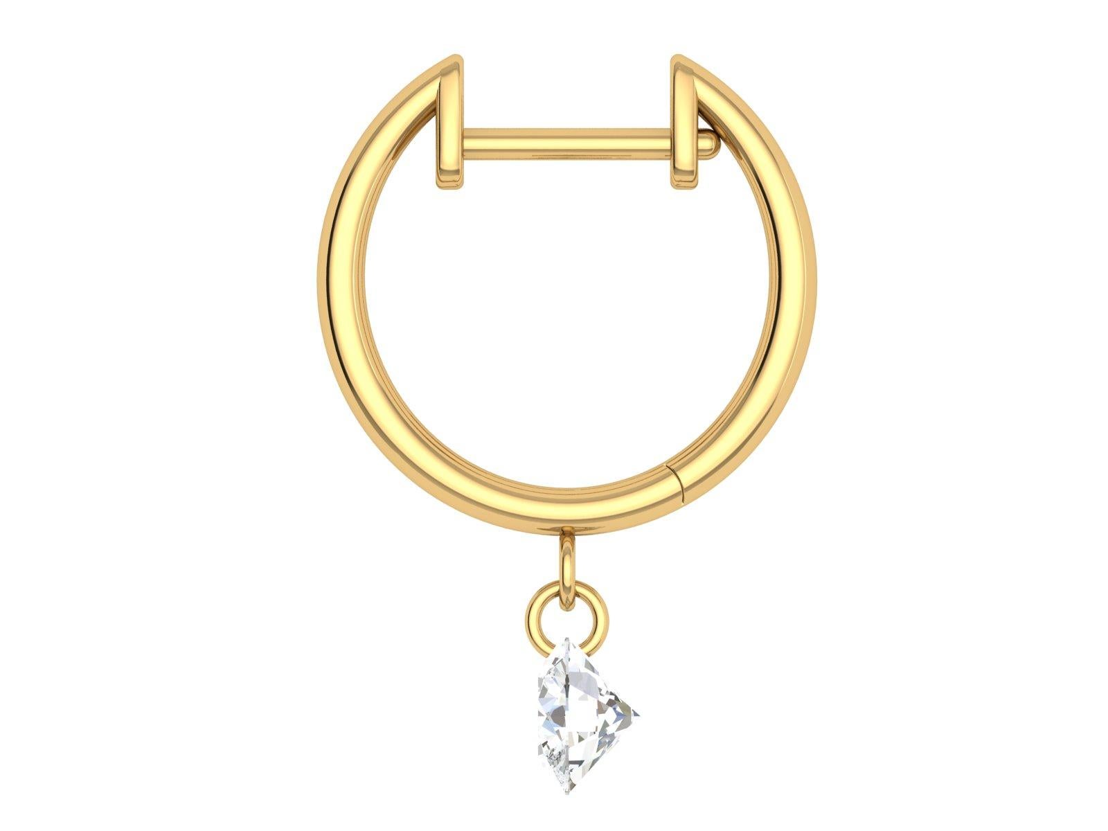 From the Bhansali Air collection, these simple and sophiscated 18kt yellow gold huggies feature a laser drilled diamond (.53cts)  dangle. What makes this piece so unique is that the diamond has no setting, which means no prongs! The diamond appears