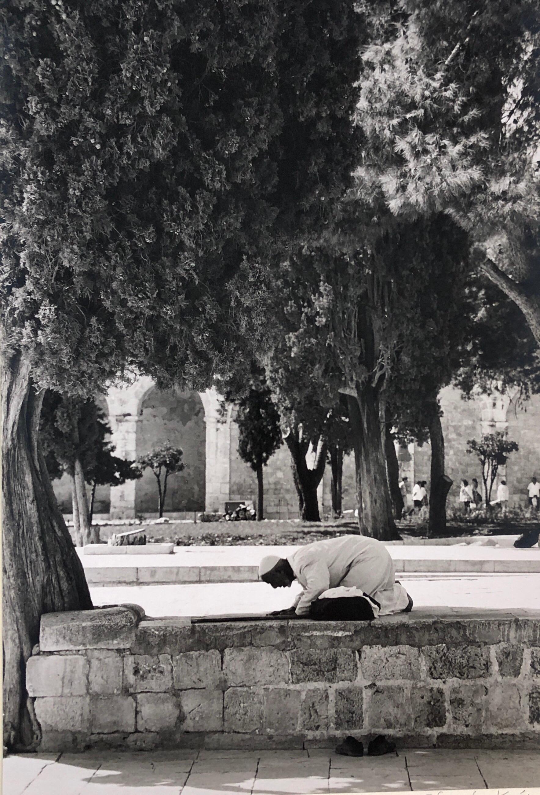 This depicts an Arab, Muslim Man bowing in prayer on the Temple Mount, 