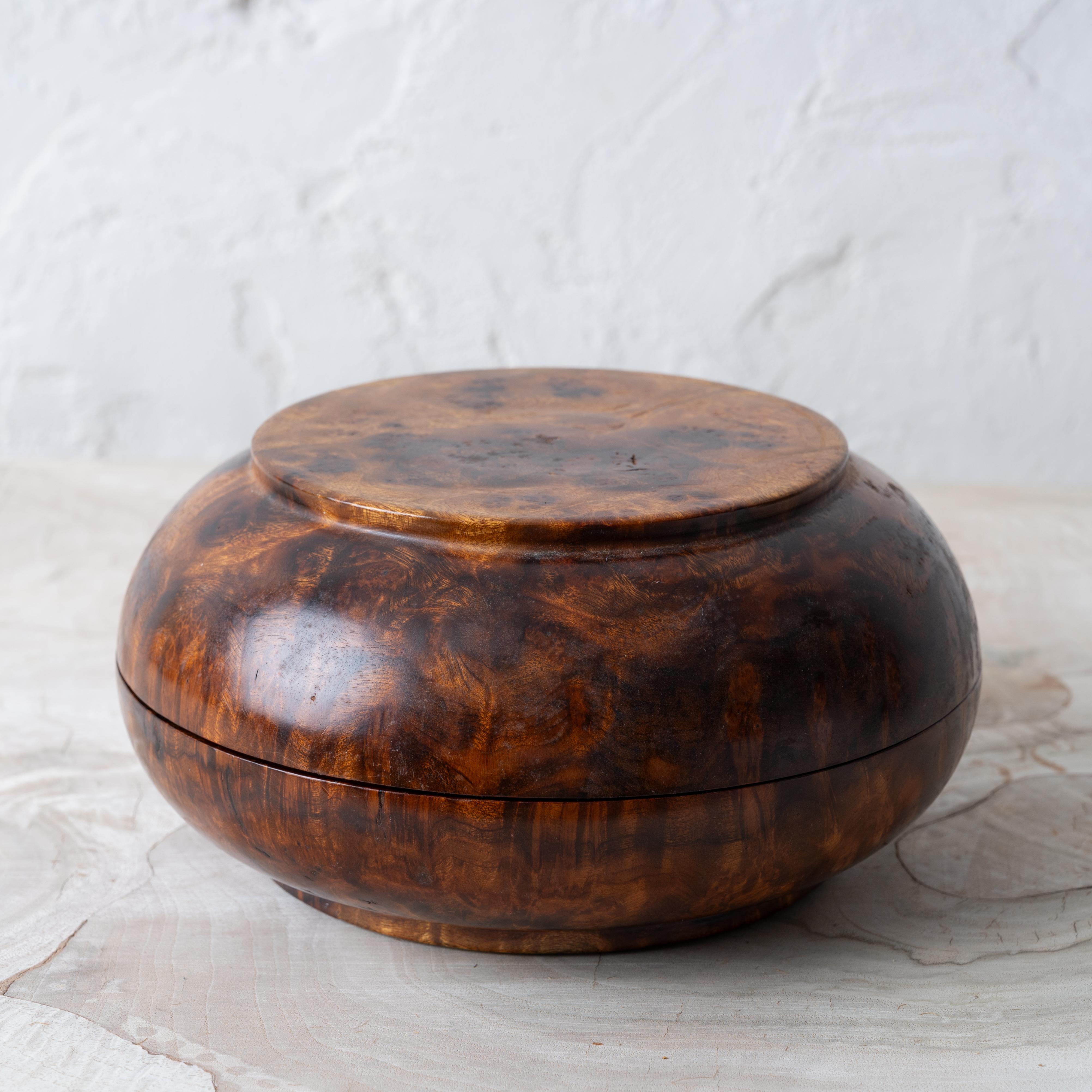 A Bhutanese turned brul dhapa bowl, made by a Bhutanese artisan in the mid-20th century.

7 ½ inches wide 3 ¾ inches tall





