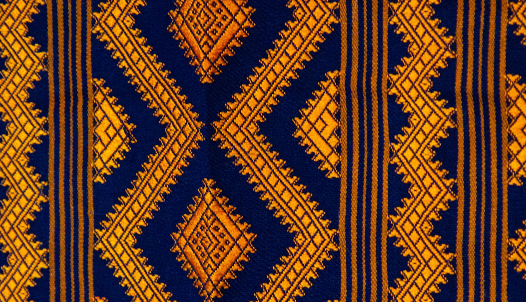 Bhutanese silk woven kira textile, purple. From the royal weavers of Bhutan, this kira textile is a rectangular weaving worn as an ankle length dress by Bhutanese women. This example was originally woven for Her Majesty Gyalyum (Queen Mother) Sangay