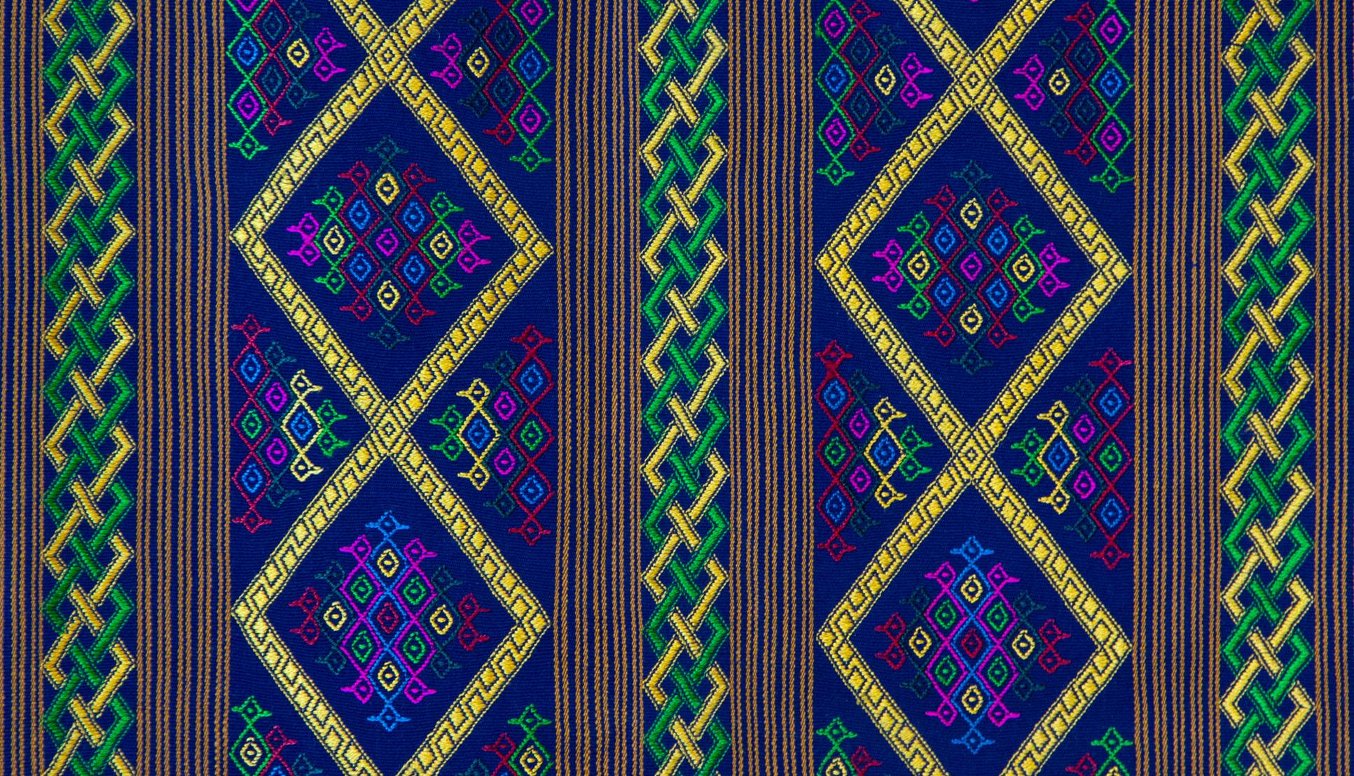 Bhutanese silk woven kira textile, purple. From the royal weavers of Bhutan, this kira textile is a rectangular weaving worn as an ankle length dress by Bhutanese women. This example was originally woven for Her Majesty Gyalyum (Queen Mother) Sangay